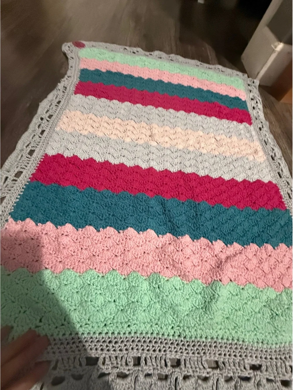 Handmade baby blanket signed by crafter with logo
